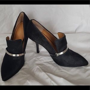 Nine West calf hair pointed toe pumps.